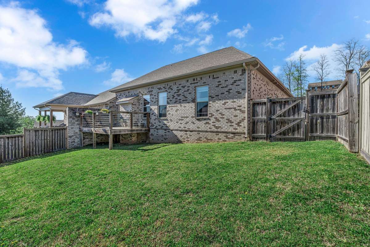 Backyard fenced area. Battery operated Mower stays with home.