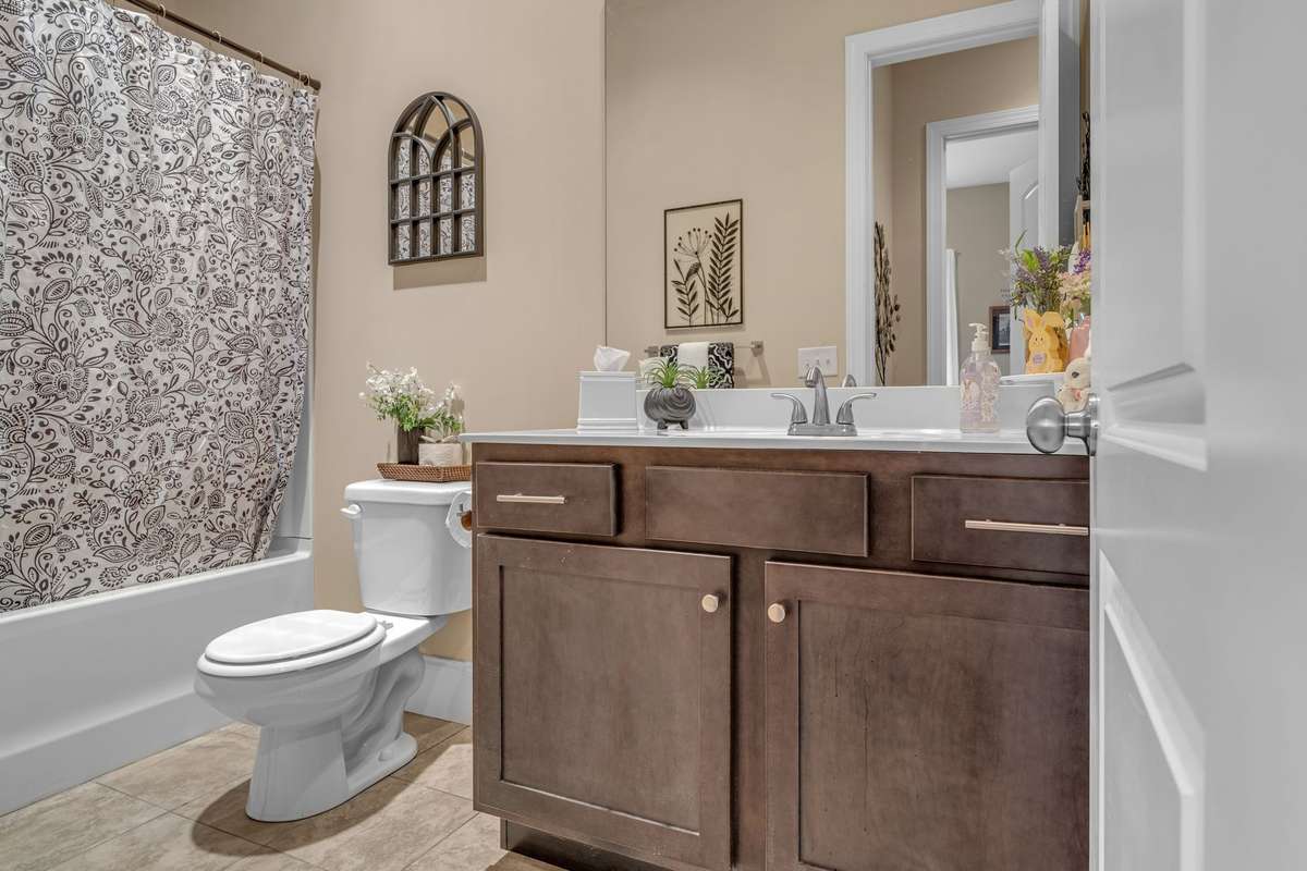 Main full bath sits very conveniently to 2nd bedroom and tucked away off Kitchen area.