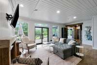 Den facing dining room and kitchen.