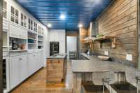 Ice maker and washer/dryer off of the kitchen at the back.