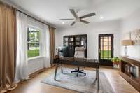 Perfect for a second bedroom on the main floor or office space! Features beautiful french doors, sizable closet, and its own entrance from the side of the home.