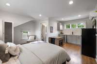 In- law studio above the garage features a kitchenette, full bath, and laundry!