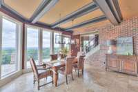 Eating area in the kitchen has that view and gorgeous beamed ceilings