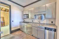 Bedroom #6 has a mini kitchen with everything you could possibly need. Access to the amazing storage space/storm shelter is here