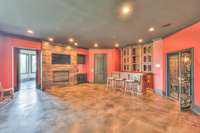 Walk out basement level has this huge entertaining space with bar and wine room. Another fireplace to enjoy!