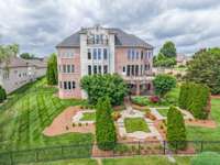 Beautiful formal gardens and fenced back yard