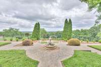 Fountain and fenced yard