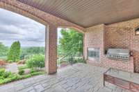 Lots of entertaining space when the weather isn't cooperating. Can you imagine grilling with this view!