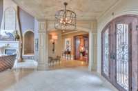 The right hall leads to one of the two private offices and a guest room