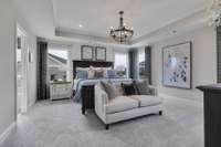 Stock Model Photo. Beautiful Primary Bedroom with included tray ceiling and lots of natural light!