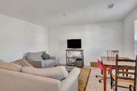 Recreation room is located on the front of the home with ample light. This place is designed thoughtfully - placing the potentially loudest room above the front of the home and not above the main living or primary suite.
