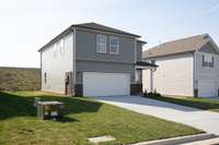 This is a photo of one of our model homes. Please know that some of the exterior and interior finishes, paint, and features may vary.