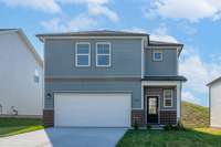This is a photo of one of our model homes. Please know that some of the exterior and interior finishes, paint, and features may vary.