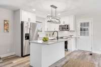 Note the black matte finished cabinet pulls and sink faucet.