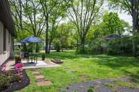 Look at that lush green backyard.  Want a garden?  You certainly have plenty of room here!