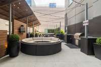 Outdoor patio area with grills and entertaining space