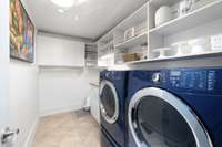 Large laundry and holds full size washer and dryer.  Lots of storage and built in space.