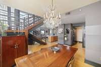Open floor plan with living, dining and office areas.