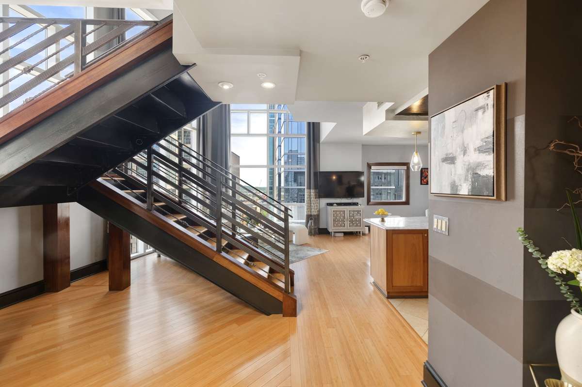 Stunning staircase to scenic landing area and bedroom levels.