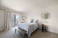 Primary bedroom with balcony