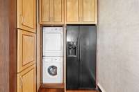 Stackable washer and dryer with lots of storage.