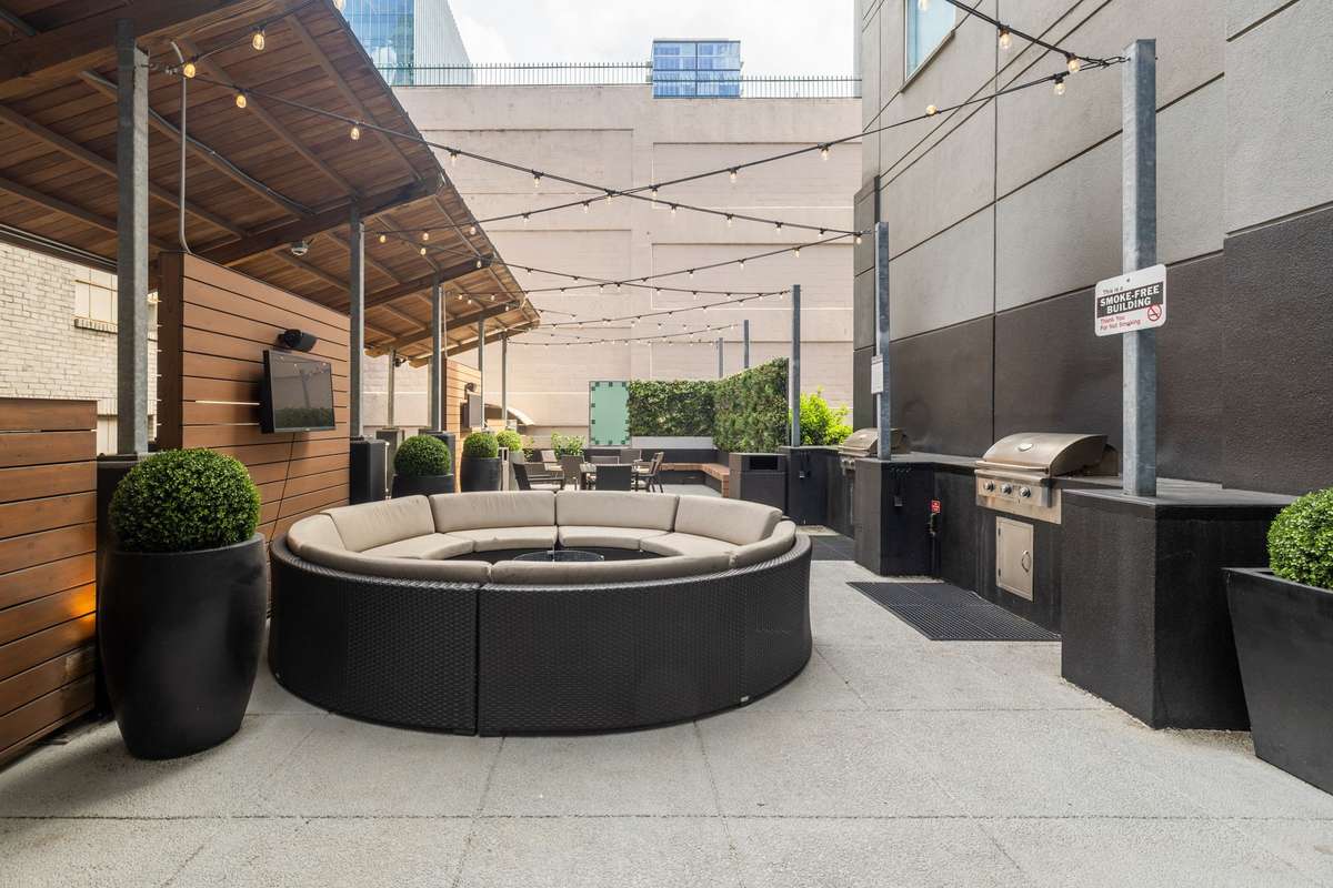 Outdoor patio area with grills