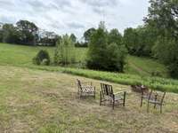 Sit by the fire pit and enjoy your private pond