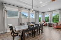 Dining and sitting area with lots of windows