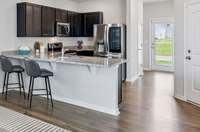 Cooks will be thrilled to whip up great meals in this kitchen. The granite counter bar accomodates four barstools.