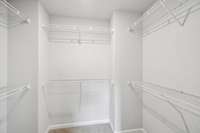 Walk-in closet in primary suite.