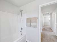 View of bathroom toward hallway.