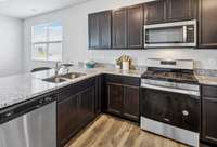 Keep the conversations flowing from the kitchen to the dining area with this open concept floorplan.
