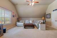 Incredible bonus room over the garage—perfect for movie nights, play space, or a home gym—complete with a large storage closet.