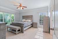 Spacious primary suite tucked at the back of the home, featuring abundant natural light and serene backyard views. Includes a large bath with extended vanity, walk-in shower, soaking tub, and a generous walk-in closet.