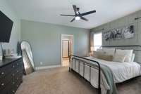 primary bedroom with board and batten accent wall