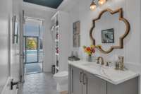 Half bath with double entry from main home and leading out to pool