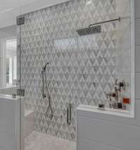 Primary shower with body sprayers, bench, and designer tile