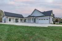 Covered breezeway from main home and front porch to additional flex space