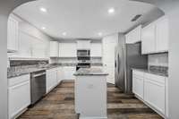The arch to the kitchen is fantastic!