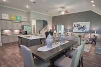 Stock photo of great room, dining, kitchen with large island combo