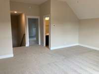 Stock photo of bonus room looking back towards stairs