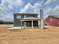 4.29 actual house with Jumbo Patio and brick fireplace with outdoor slab for lounge chairs, grill or future pergola?