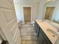 Owner's suite with double raised vanity