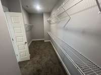 Actual home site showing primary bedroom's massive walk in closet