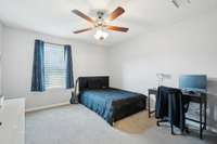 Bedroom 2 features cozy carpet flooring, a ceiling fan, and a single window that lets in natural light. 2336 Convention Way Murfreesboro, TN 37130