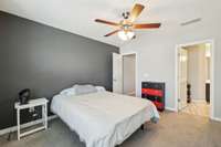 The primary bedroom features a stylish accent wall, soft carpet flooring, and a ceiling fan for year-round comfort.  2336 Convention Way Murfreesboro, TN 37130