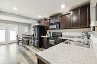 The kitchen offers ample counter space and a raised bar top, perfect for meal prep and casual dining. 2336 Convention Way Murfreesboro, TN 37130