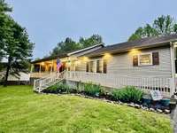 Wrapped in peaceful privacy and glowing with charm, this accessible ranch welcomes you home. Stunning at twilight and full of unique upgrades—schedule your private tour today before someone else claims this gem!