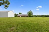 The expansive backyard presents numerous opportunities for landscaping, gardening, or additional outdoor projects! 1761 Center Hill Rd. Woodbury, TN 37190