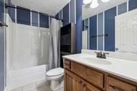 The full guest bath features a combo shower and tub, along with a single vanity for functional and comfortable use. 1761 Center Hill Rd. Woodbury, TN 37190